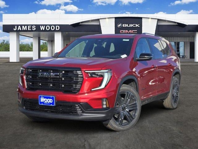 2026 GMC Acadia Elevation in Volcanic Red Tintcoat — front three-quarter view